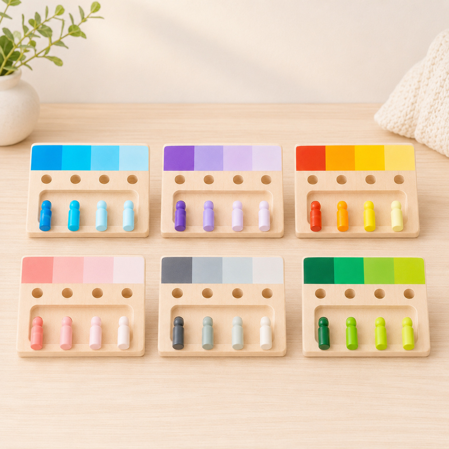 Tabuleiros Montessori de encaixe de cores em madeira sob luz suave